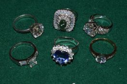 A collection of silver dress rings.