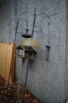 Two pole bird feeders and a bird table.