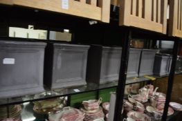 A quantity of small faux lead planters.