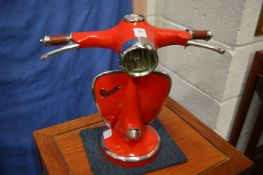 A Vespa scooter style table lamp.