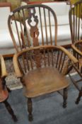 A 19th century ash and elm Windsor armchair.