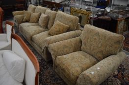 A Parker Knoll four piece lounge suite comprising three seater settee, pair of armchairs and