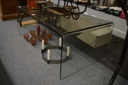 A stylish glass coffee table.