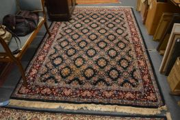 A Persian design carpet, green ground with stylised floral decoration, 260cm x 180cm.