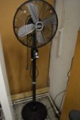 A large floor standing electric fan.