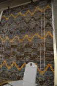 A large berber style woollen carpet, 388cm x 180cm.