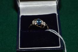 A 9ct gold and gem set ring.