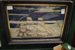 A wool work picture of a sailing ship.