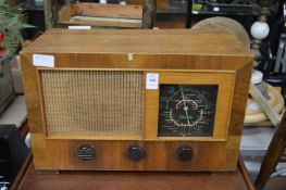A Strad walnut cased radio.