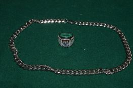 A heavy stainless steel chain and a decorative ring.
