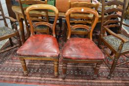A pair of Victorian mahogany dining chairs.
