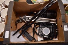 A Nikon F90 with motor drive, a Sigma zoom lens, two tripods and an Olympus motor drive.