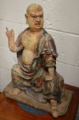 A good rare large 18th century carved wood and polychrome decorated seated Buddha.
