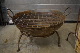 A wrought iron fire pit.