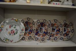 A Chinese porcelain plate painted with flowers together with a set of four Imari decorated plates