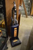 A Sebo upright vacuum cleaner.