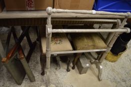 A painted towel rail and other items.