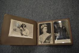 Photograph album containing Royal Commemorative postcards.