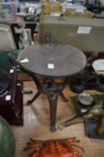 An African carved wood occasional table or stool with folding base.