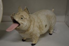 An amusing cast iron model of a pig.