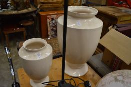 Two large pottery vases.