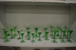 A part suite of clear glass drinking glasses.