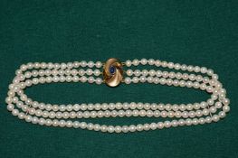 A good 18ct gold, cabochon, sapphire and pearl three row choker.