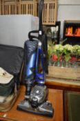 A Kirby Avalir 2 upright vacuum cleaner.