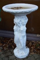 A large painted bird bath.