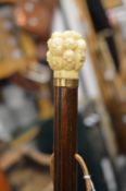 Walking stick with carved bone handle.