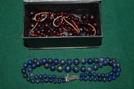 A lapis bead choker and other items.