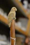 A small swagger stick, the handle modelled as a parrot.