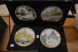 A boxed set of Noritake Four Seasons plates.