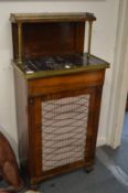 A Regency rosewood pier cabinet with galleried upper section, marble top above a frieze drawer and
