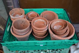 A quantity of terracotta plant pots.