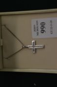 A diamond set crucifix and chain.