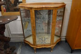 A walnut display cabinet.