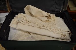 Two suitcases containing various linen.