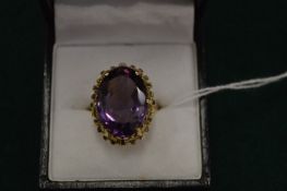 A 9ct gold and amethyst ring.