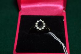 A 9ct gold and gem set ring.