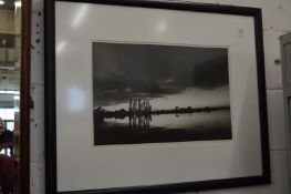 A lakeside view at dusk, black and white photographic print.