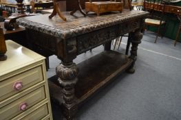 A Jacobean revival two drawer carved oak buffet.