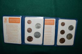 Two wallets containing the first decimal coins.