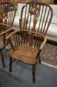 A 19th century ash and elm Windsor armchair.