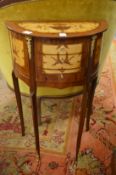 A pair of French style marquetry inlaid demi-lune three drawer bedside tables.