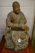 A good rare large 18th century carved wood and polychrome decorated seated Buddha.