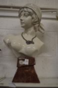 A large Art Deco style porcelain bust of a woman.