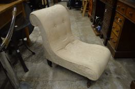 A small upholstered chair.