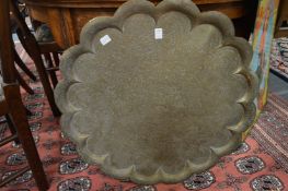 An engraved Islamic copper tray and an engraved brass tray.