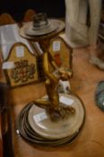 An Art Deco cast metal and alabaster figural lamp base.